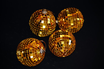 Golden balls on black