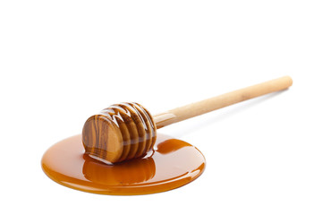 wild honey and wooden dipper isolated