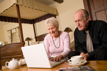 Senior couple with laptop