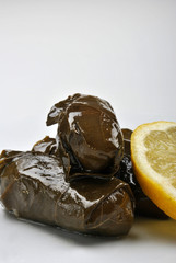 vine leaves and lemon, basil on a plate