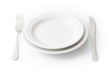 Served place setting: empty dinner plate on white background