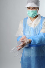 woman wearing plastic gloves for protection