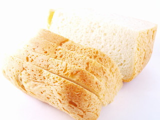 The cut bread on a white background