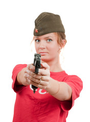 Photo of a beautiful girl in overseas cap holding gun.