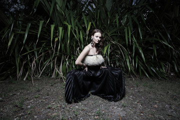 Fototapeta premium Beautiful model posing in a field at night