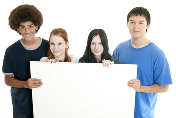 Teens with blank sign