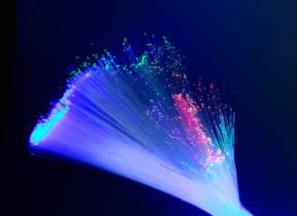 bunch of optical fibres dinamic flying from deep on technology background