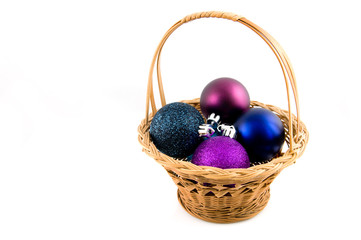 Christmas balls in wooden basket