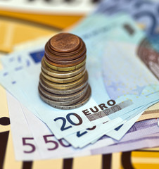 Euro cent pile and banknotes