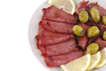 sliced served sausage with raw lemon
