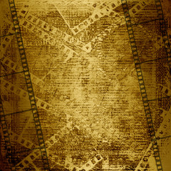 Fototapeta premium Old paper and grunge filmstrip on the abstract background