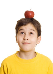 Boy with apple on his head