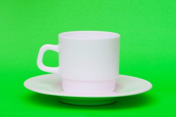 White cup isolated on the colourful background