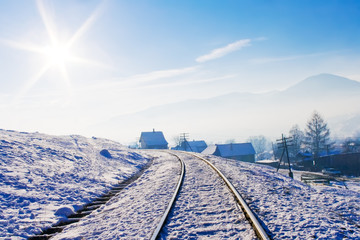 Railroad in snow covered mountains