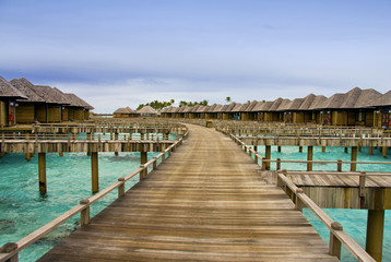 Fototapeta premium Hotel on tropical island, Maldives, water villas