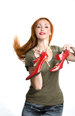 .The young beautiful woman with the elegant red shoes