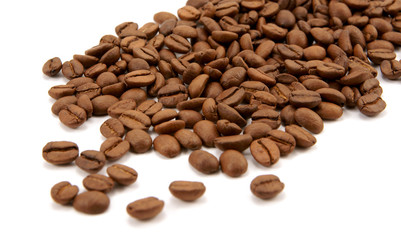 Spilled coffee beans on white background