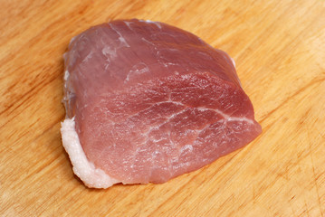 Pork meat on cutting board