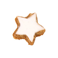Christmas star shaped cookie with white icing isolated on white
