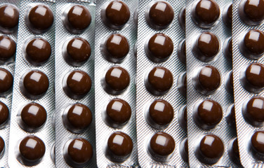 Packings of medical pills and tablets.