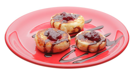 cheese pancakes with chocolate syrup and jam