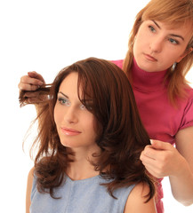 Naklejka premium Stylist makes hair