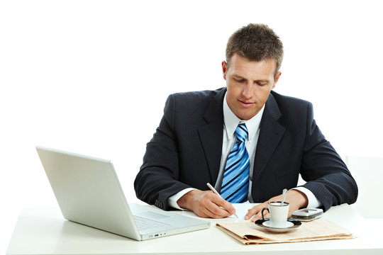 Businessman writing notes