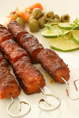grilled mince roll with fresh vegetables on a plate