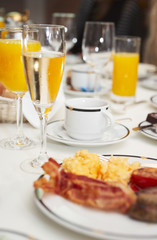 Prepared table with champagne and juice