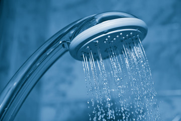 Fototapeta na wymiar water flowing from metal shower
