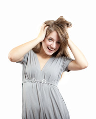 Fototapeta premium Portrait of young model in grey dress