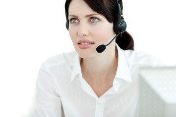 Serious businesswoman with headset on