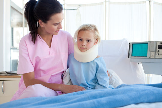 A nurse looking after a petient wih a neck brace