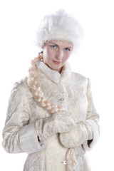 Beautiful girl in a white winter coat