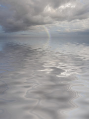 rainbow reflected in the sea