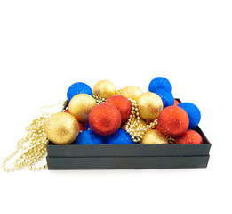 Set of  blue,red  and gold Christmas balls in a black box