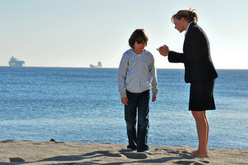 Fototapeta premium Mother and son playing at the beach