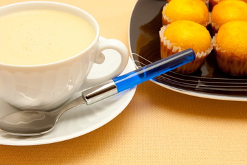 Closeup of coffee with milk in white cup
