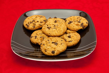 plate of cookies on red background