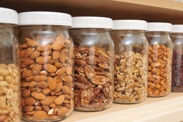 Healthy Nuts in Glass Jars - Powered by Adobe