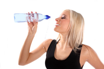 Woman in fitness attire holding water bottle