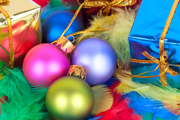 Colorful Christmas presents and feathers.