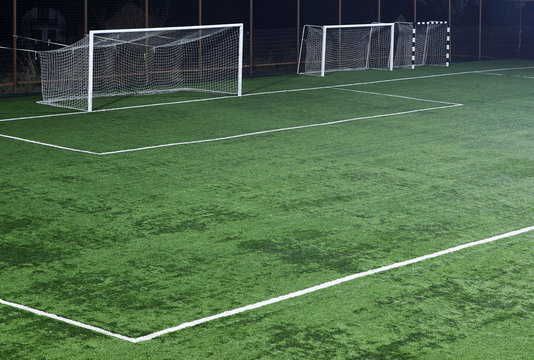 Football pitch with tree goals