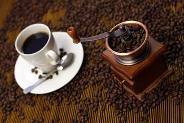 Grinder and Coffee Cup