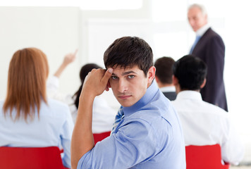 Bored businessman at a conference