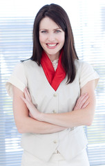 Attractive businesswoman with folded arms