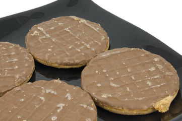 chocolate biscuits on plate isolated on white background