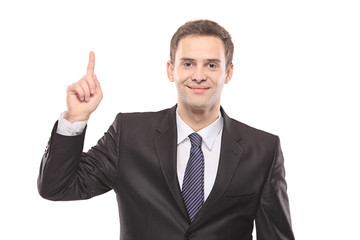 A businessman pointing isolated on white background