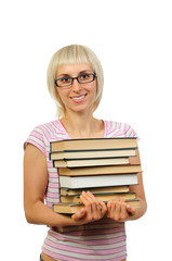 Young woman with stack of books isolated on white
