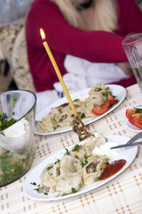 Festive dinner table with candle
